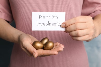Photo of Woman holding golden eggs and card with phrase Pension Investments, closeup