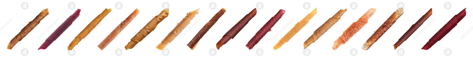 Image of Set with different delicious fruit leather rolls on white background. Banner design 