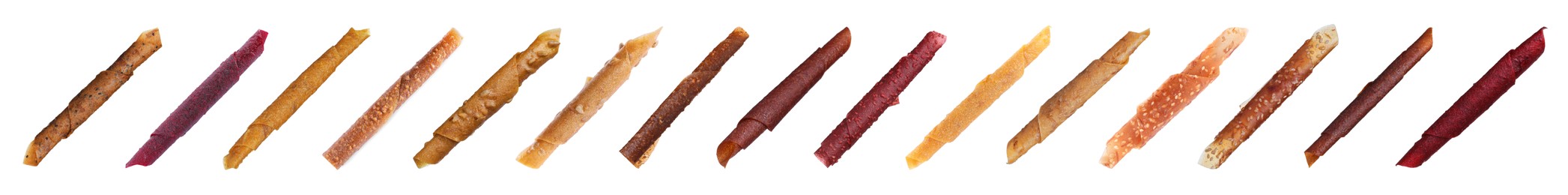 Set with different delicious fruit leather rolls on white background. Banner design 