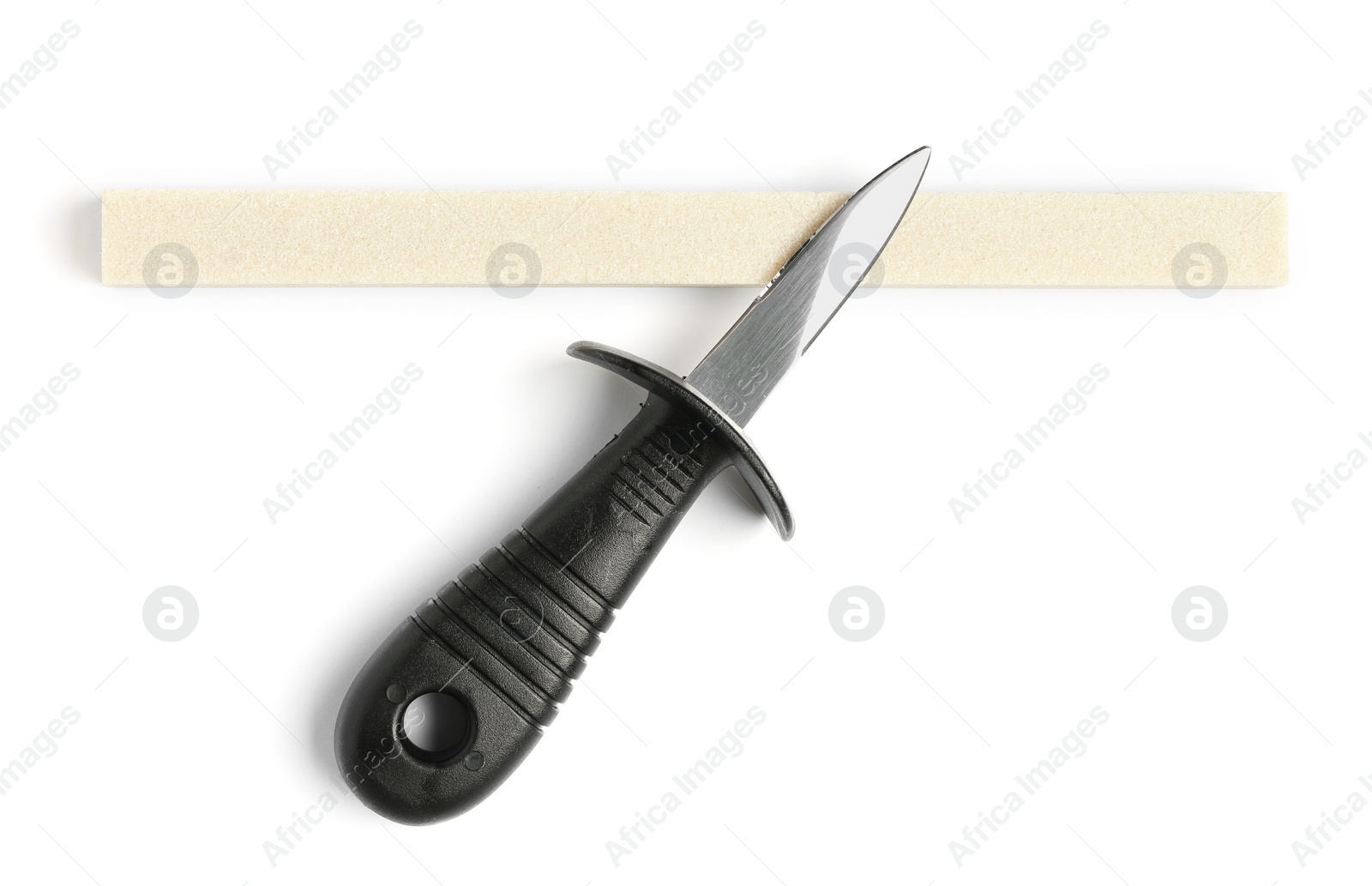 Photo of Oyster knife and grindstone isolated on white, top view
