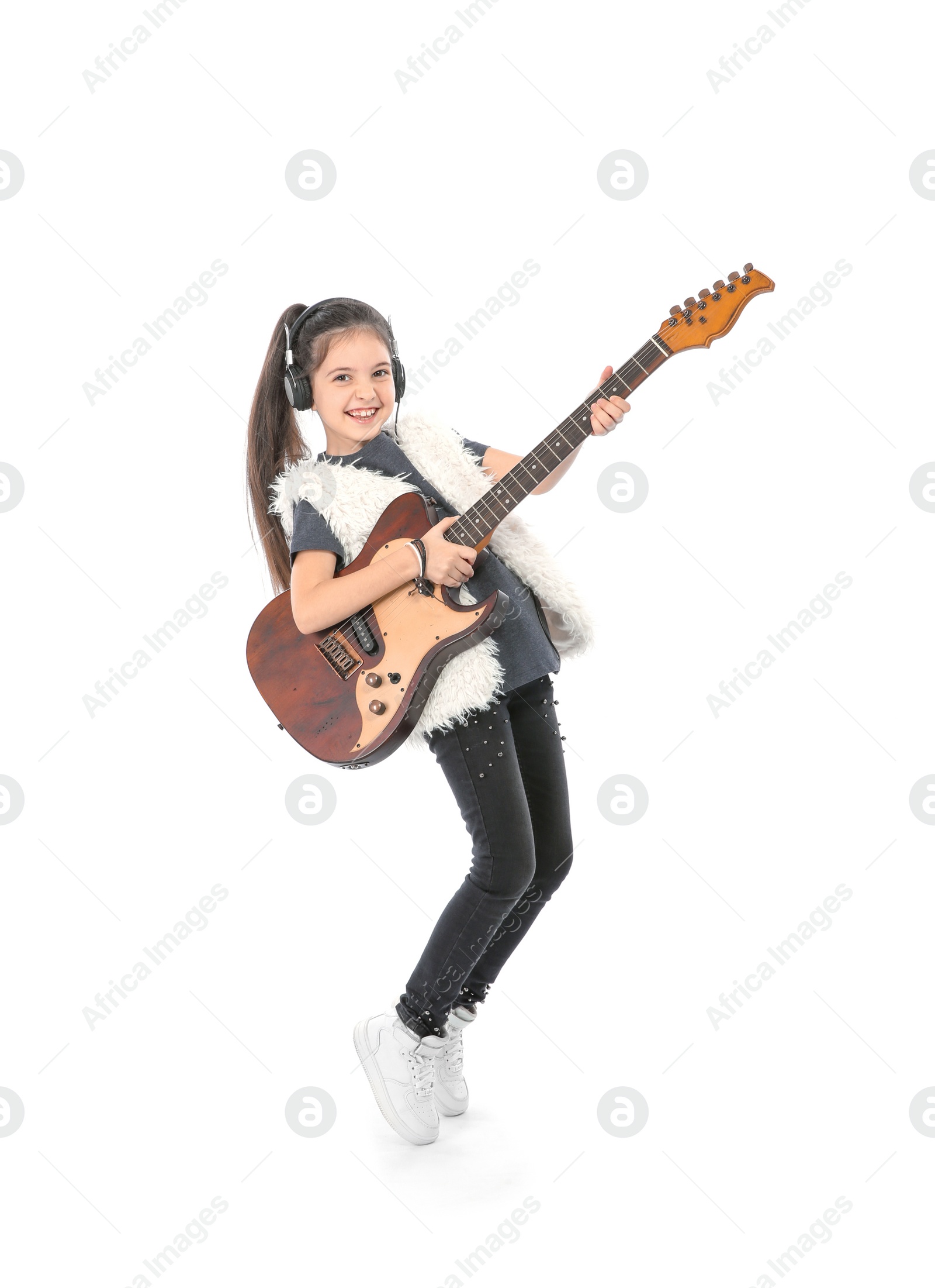 Photo of Emotional little girl playing guitar, isolated on white