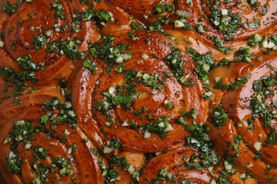 Photo of Traditional Ukrainian garlic bread with herbs (Pampushky), closeup view