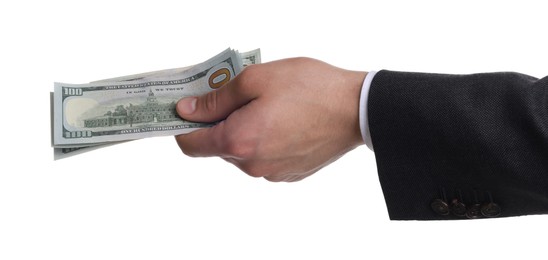 Photo of Money exchange. Man holding dollar banknotes on white background, closeup