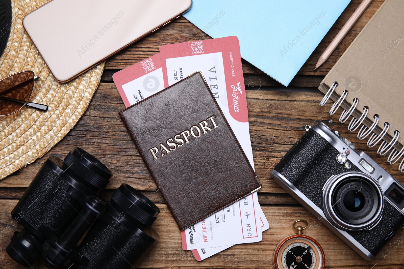 Photo of Flat lay composition with passport and tickets on wooden table