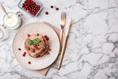 Photo of Plate with delicious pancakes on table