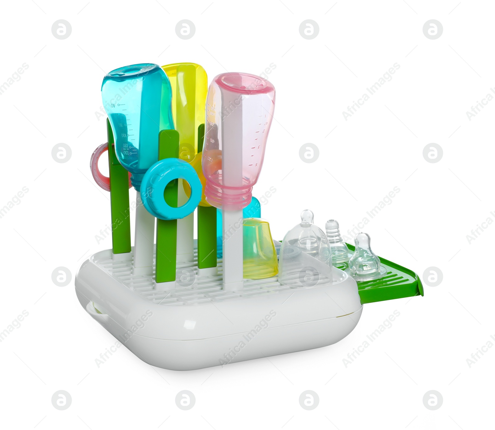 Photo of Dryer with baby bottles and nipples after sterilization on light grey table against white background