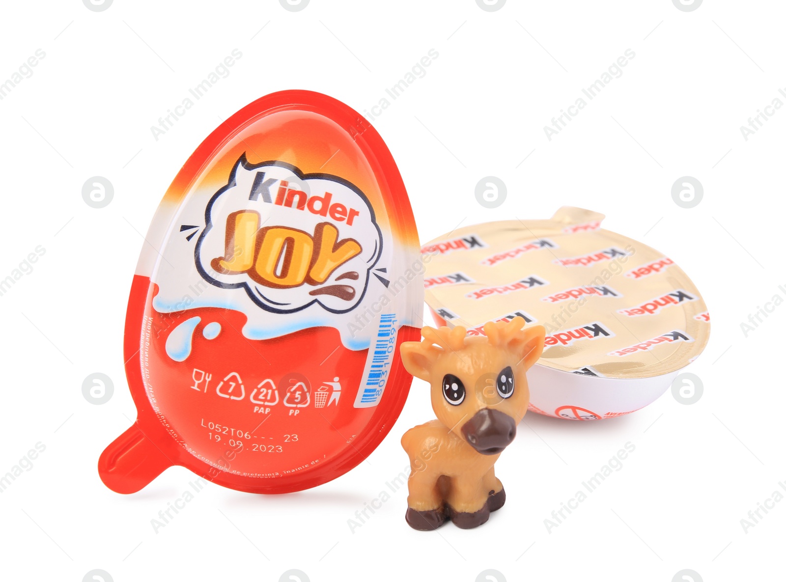Photo of Slynchev Bryag, Bulgaria - May 24, 2023: Kinder Joy Egg and toy deer isolated on white