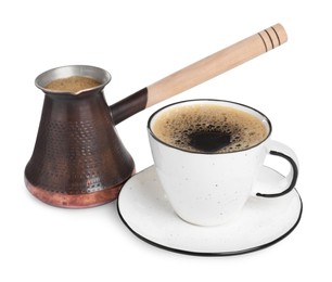 Photo of Metal turkish coffee pot and cup of hot drink on white background