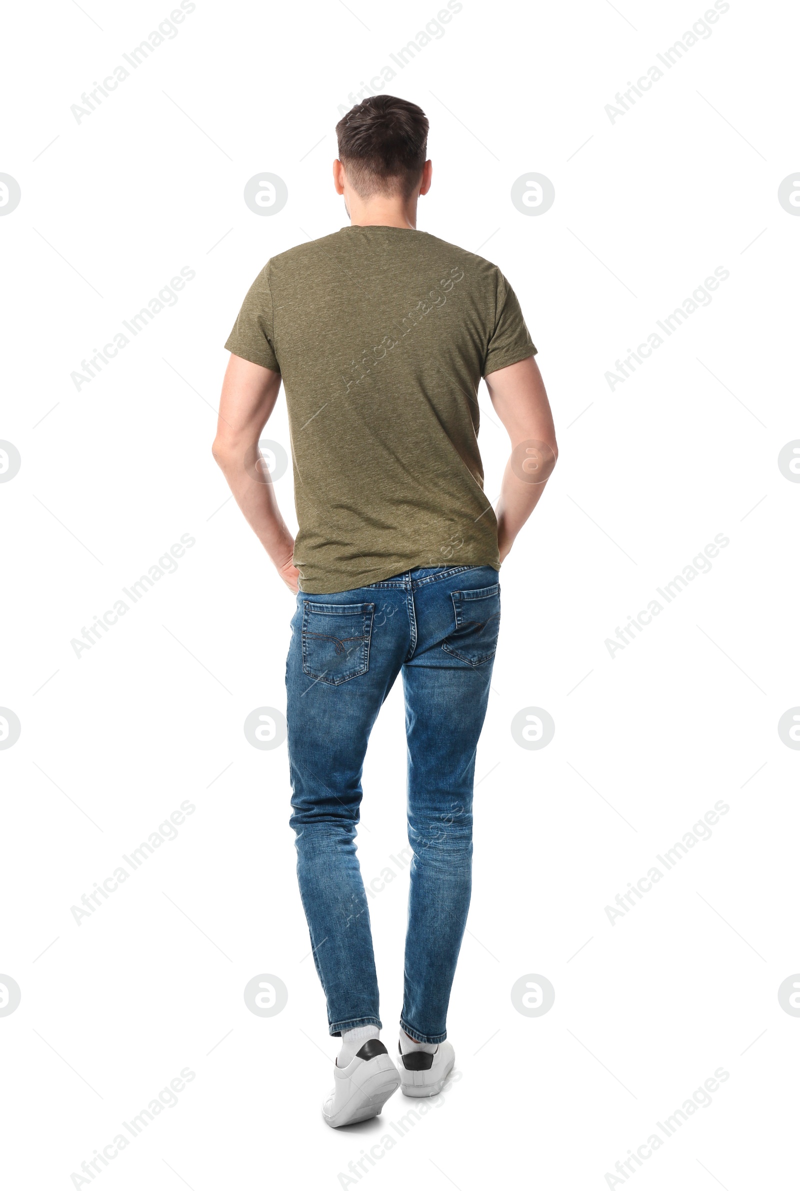 Photo of Young man in casual clothes posing on white background