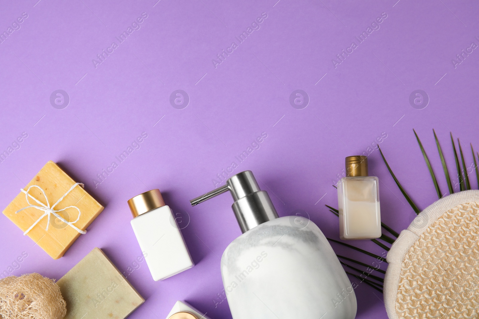 Photo of Flat lay composition with marble soap dispenser on violet background. Space for text