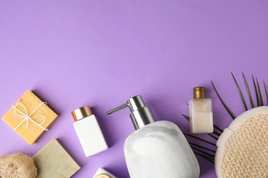 Photo of Flat lay composition with marble soap dispenser on violet background. Space for text