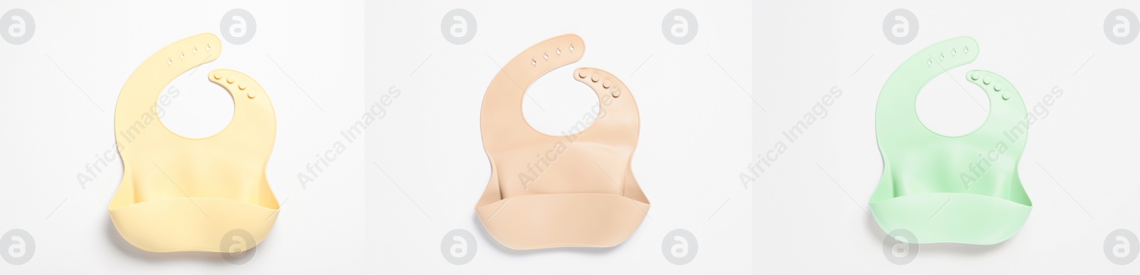 Image of Set with different silicone baby bibs on white background, top view. Banner design