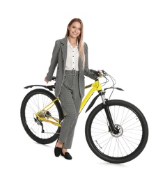 Photo of Young businesswoman with bicycle on white background