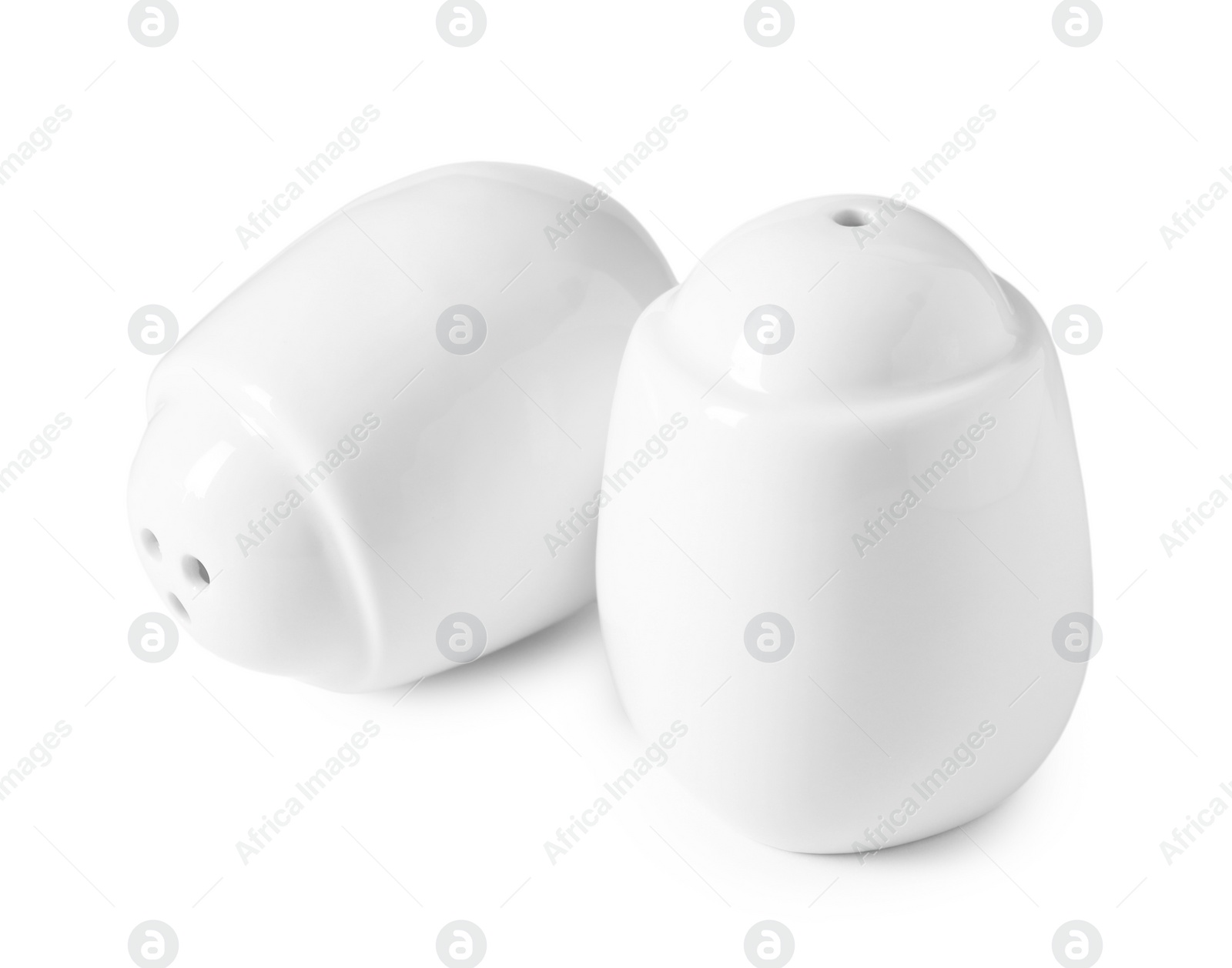 Photo of Salt and pepper shakers isolated on white