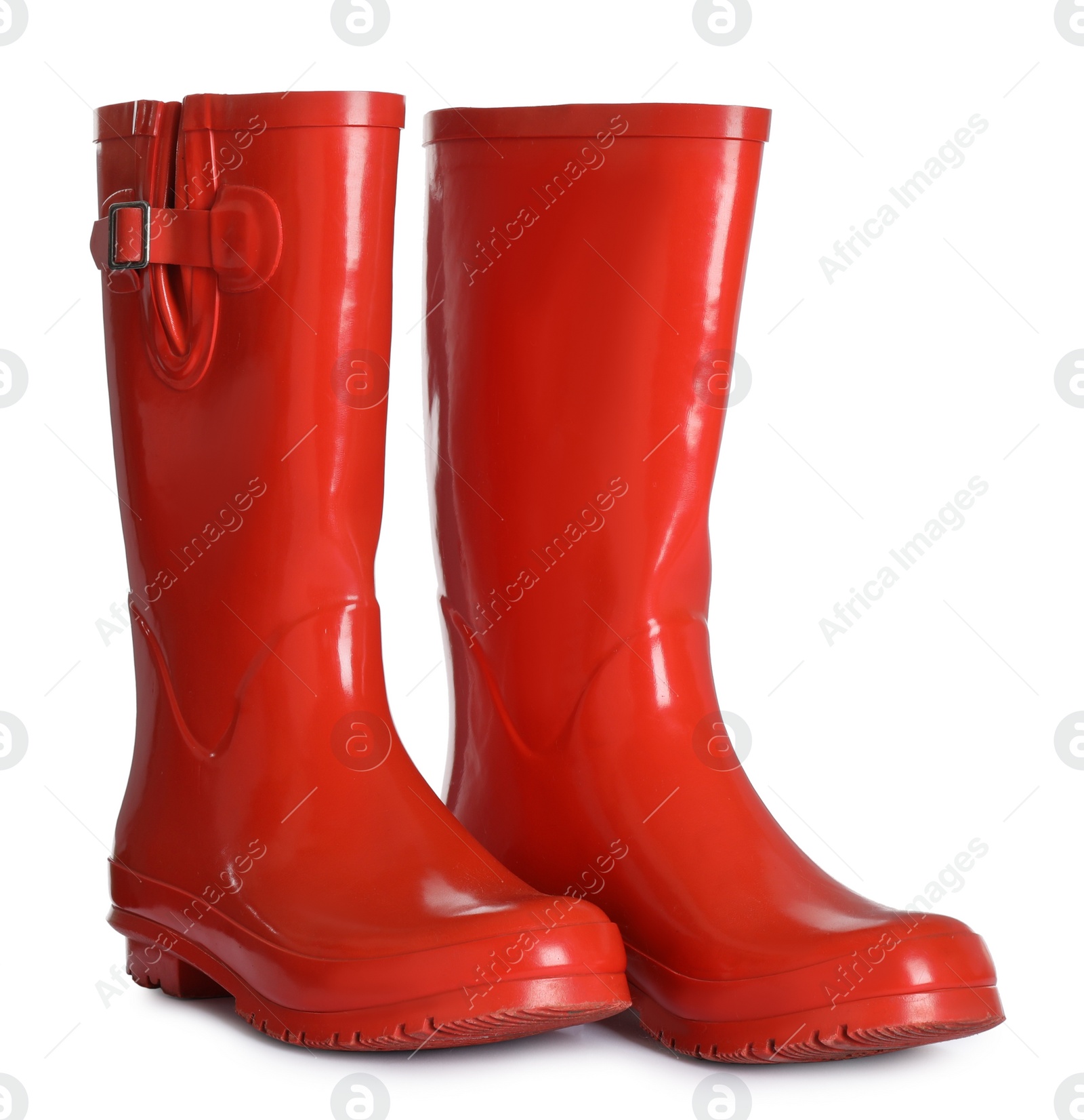 Photo of Modern red rubber boots isolated on white