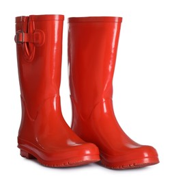 Photo of Modern red rubber boots isolated on white