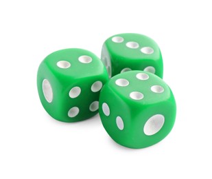 Photo of Three green game dices isolated on white