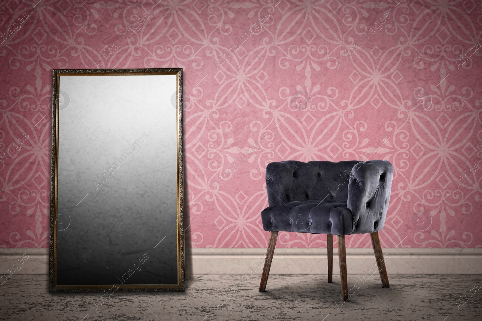 Image of Armchair and mirror near wall with patterned wallpaper. Stylish room interior