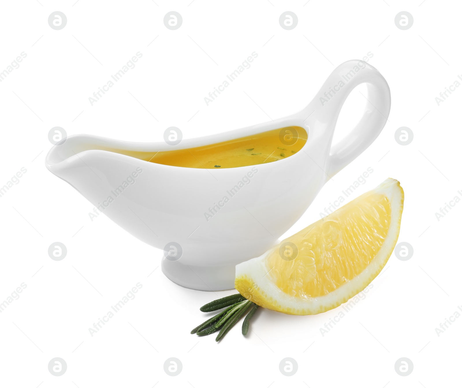 Photo of Ceramic sauce boat with lemon salad dressing and ingredients on white background