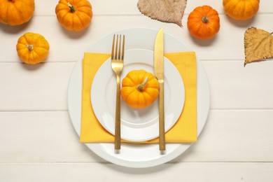 Photo of Stylish autumn table setting on white wooden background, flat lay