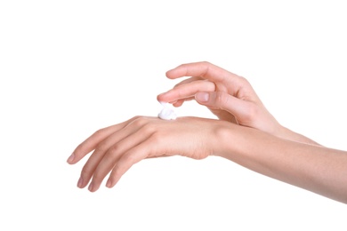 Photo of Young woman applying hand cream against on white background