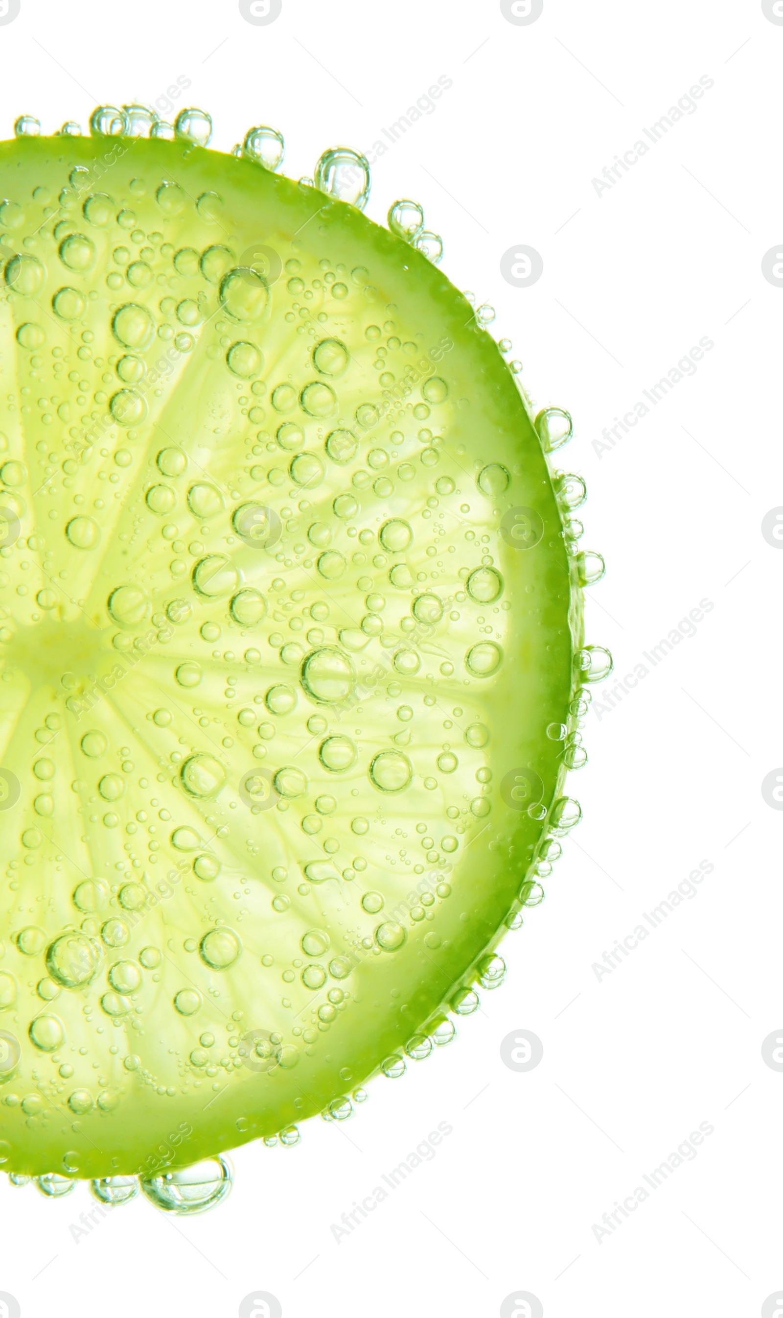 Photo of Fresh lime slice in sparkling water on white background