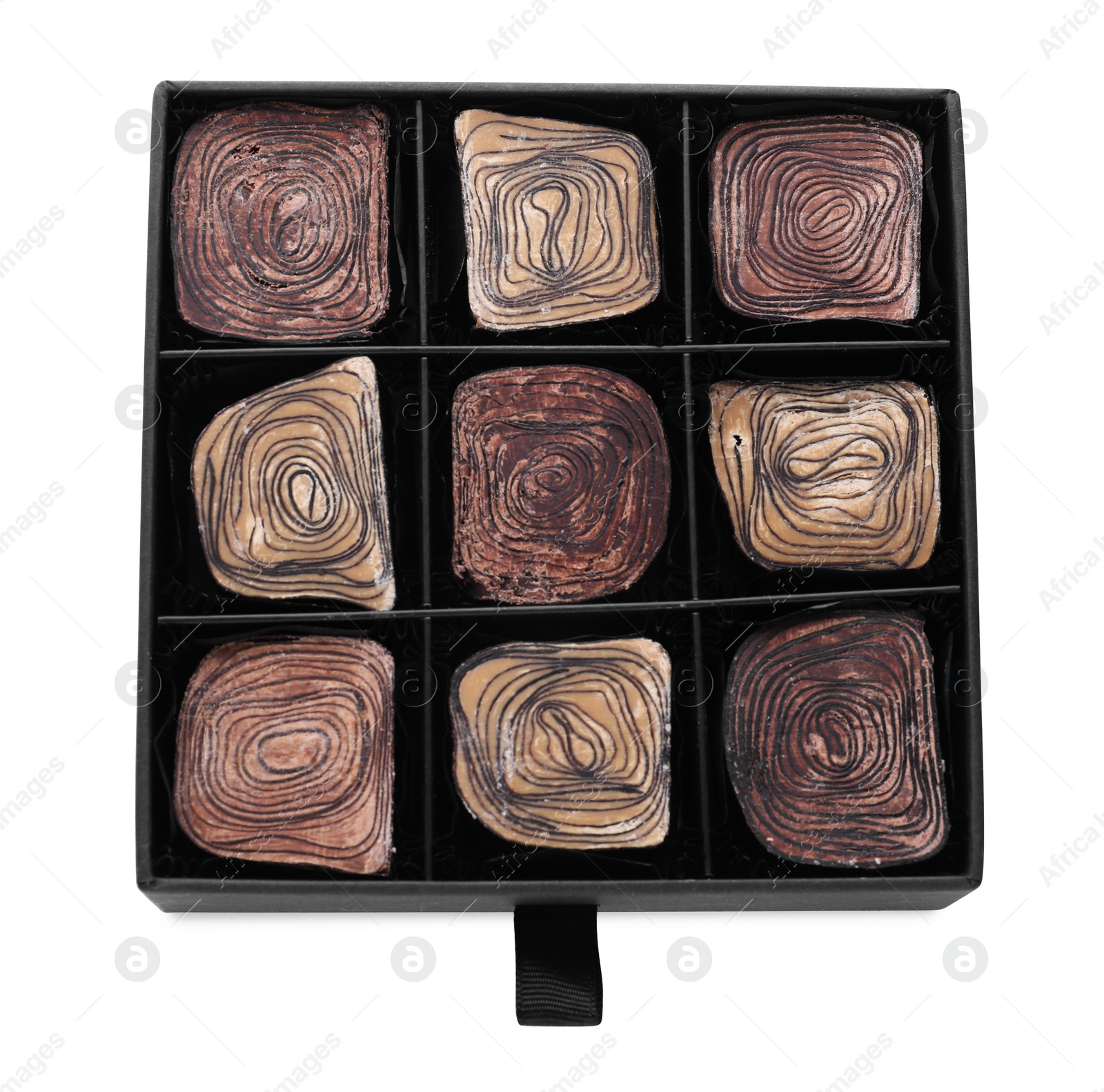 Photo of Box of delicious chocolate candies isolated on white, top view