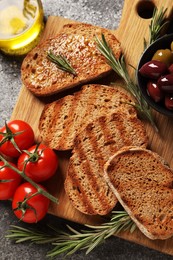 Photo of Flat lay composition with bruschettas on grey table