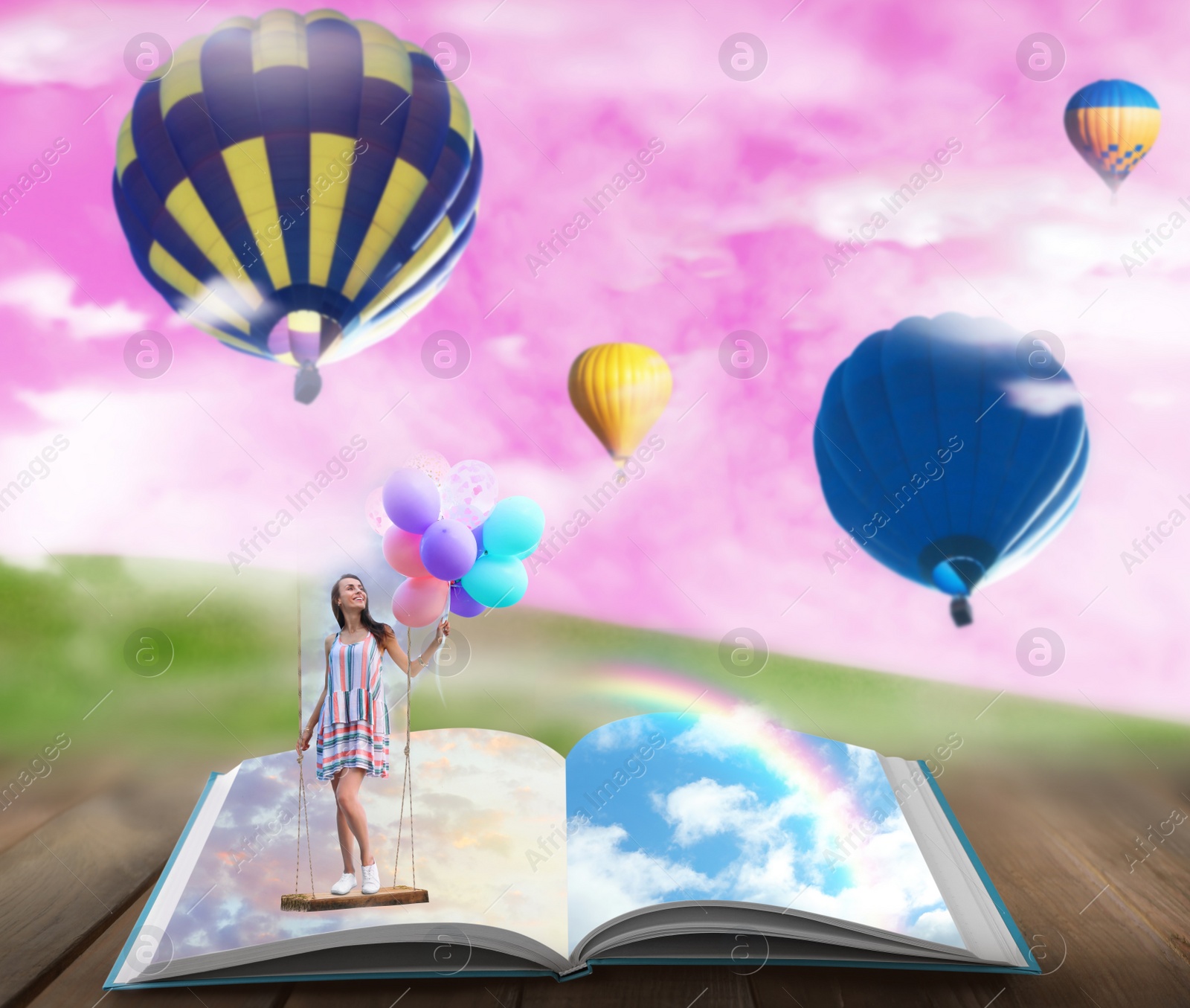 Image of Fantasy worlds in fairytales. Book, hot air balloons and pink sky over misty green meadow on background