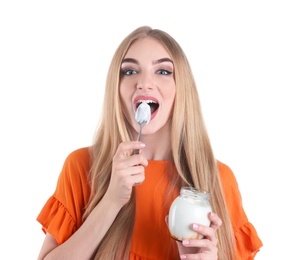 Young woman with yogurt on white background