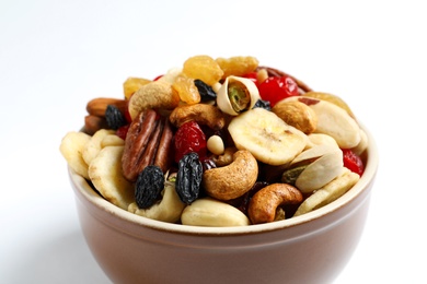 Photo of Bowl with different dried fruits and nuts on white background, closeup