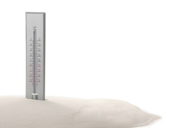 Weather thermometer in sand against white background