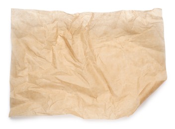 Photo of Sheet of crumpled brown baking paper on white background, top view