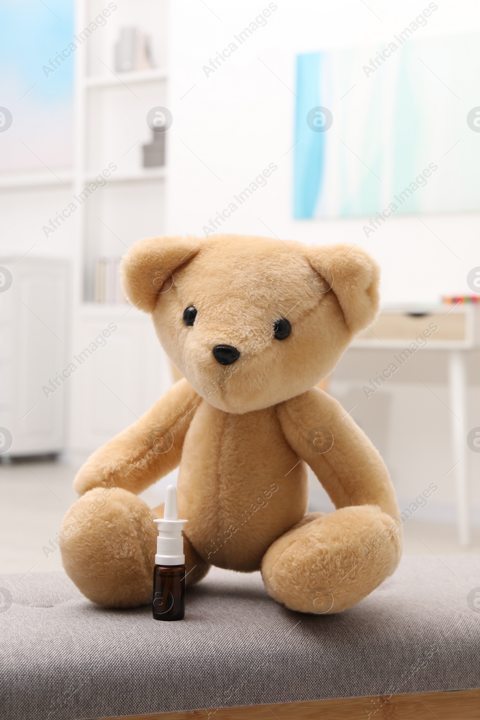 Photo of Toy cute bear with nasal spray indoors