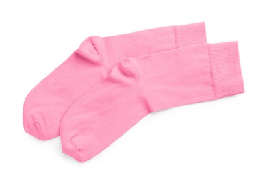 Photo of Pair of pink socks on white background, top view