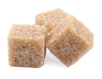 Photo of Three brown sugar cubes isolated on white