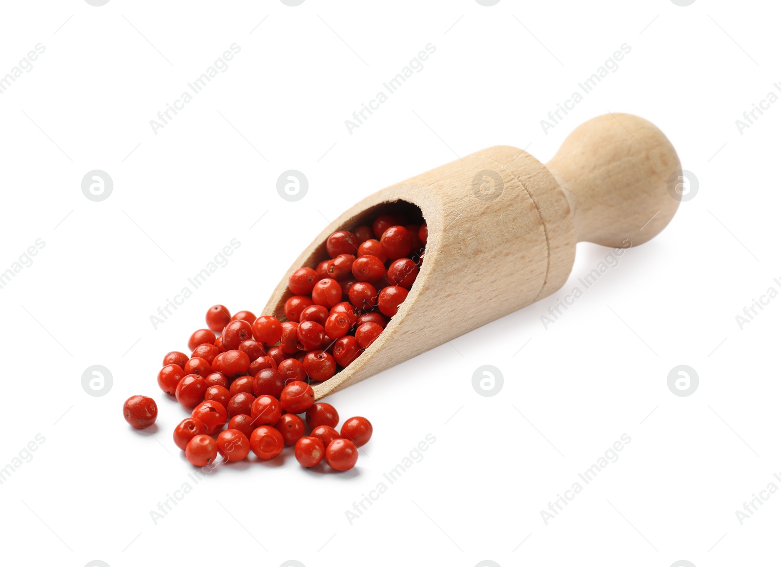 Photo of Aromatic spice. Red pepper in scoop isolated on white