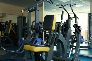 Photo of Seated rowing hammer machine in modern gym