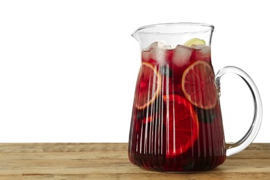 Photo of Glass jug of Red Sangria on wooden table against white background. Space for text