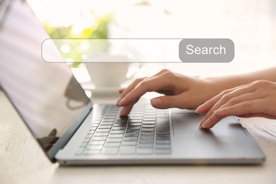 Search bar of website over laptop. Woman using computer at wooden table, closeup