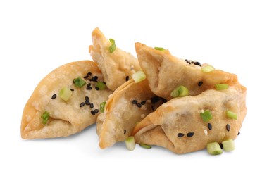 Photo of Delicious gyoza (asian dumplings) with sesame and onion isolated on white