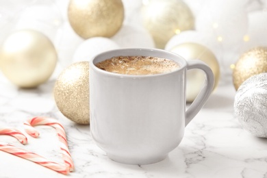 Photo of Composition with cup of hot winter drink on table. Cozy season