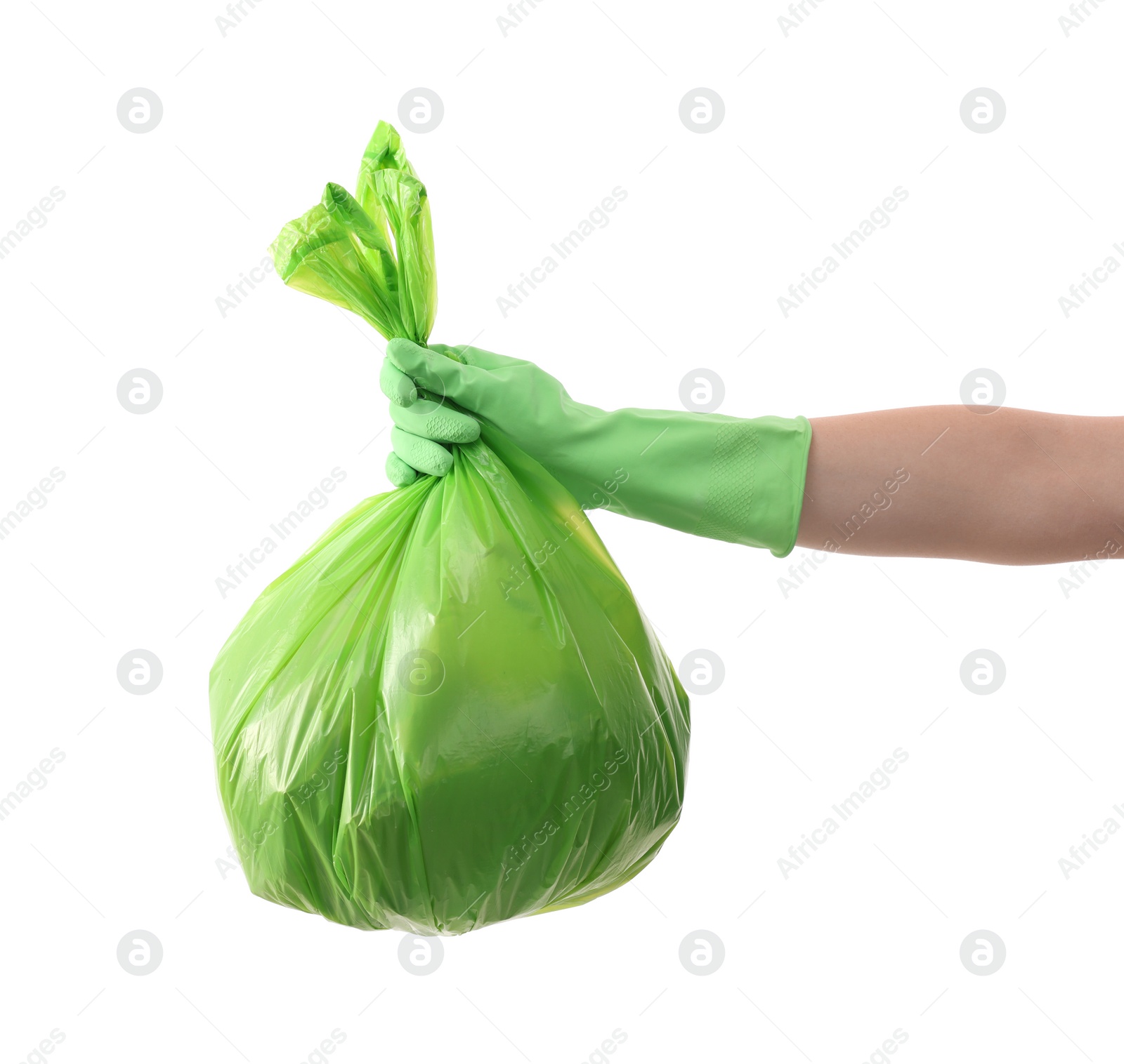 Photo of Woman holding plastic bag full of garbage on white background, closeup