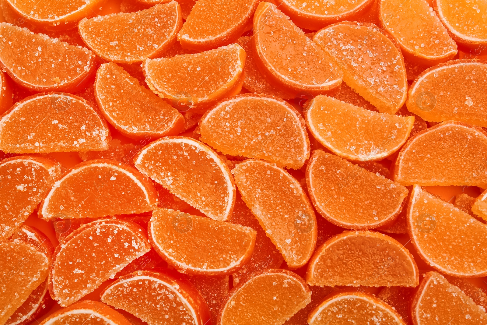 Photo of Sweet orange marmalade as background, top view