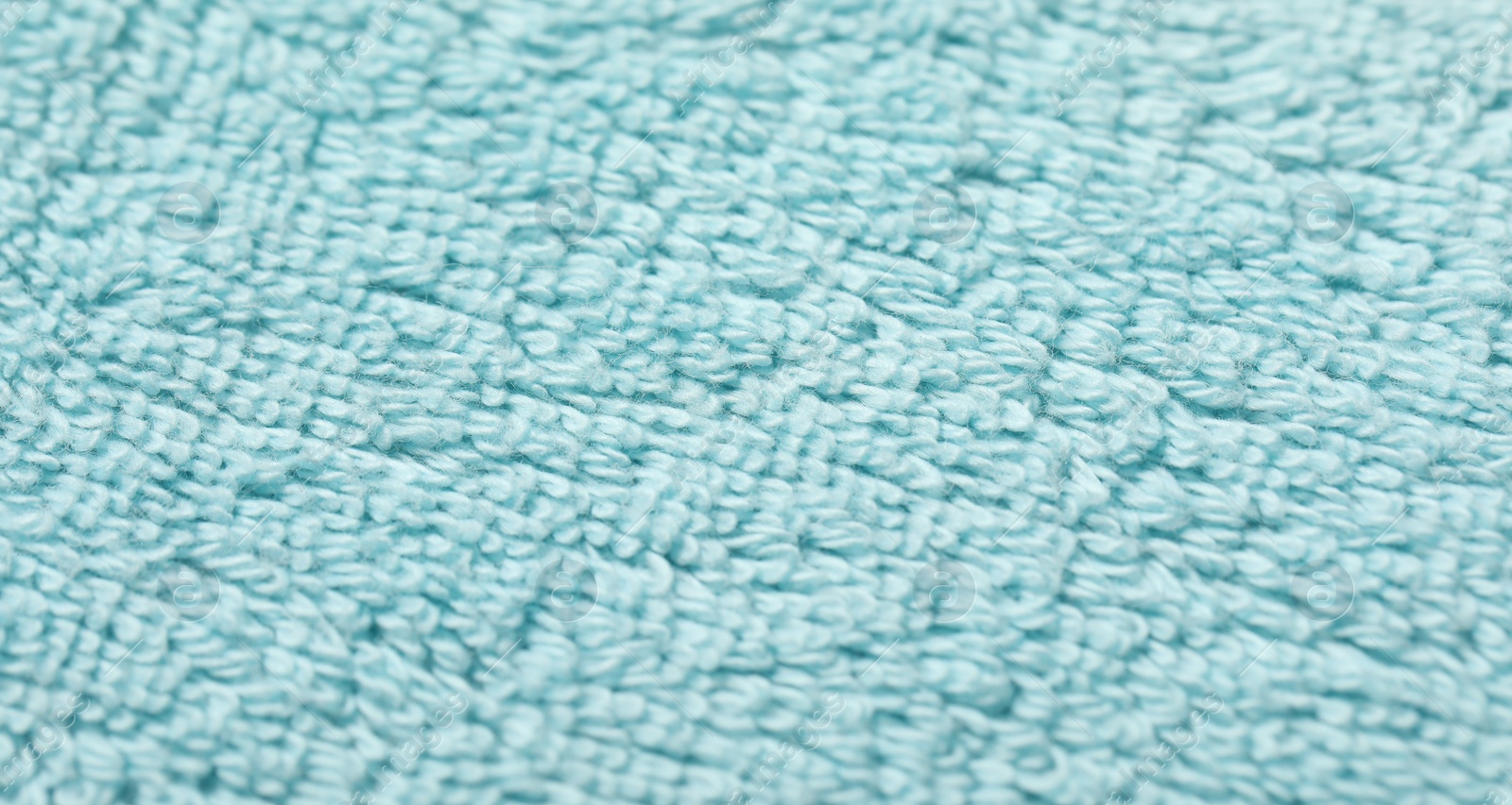 Photo of Texture of soft light blue fabric as background, top view