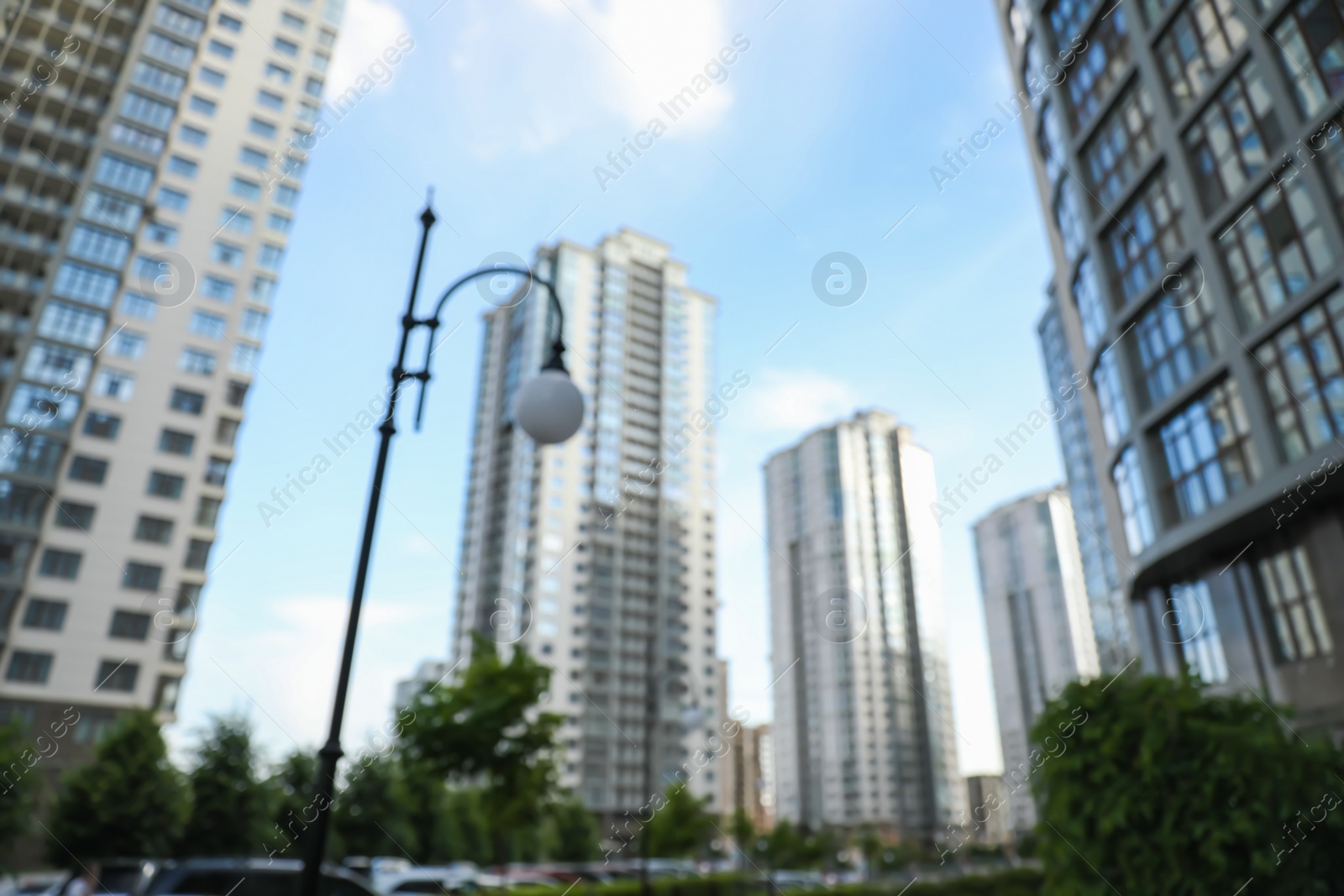 Photo of Blurred view of modern buildings with windows. Urban architecture