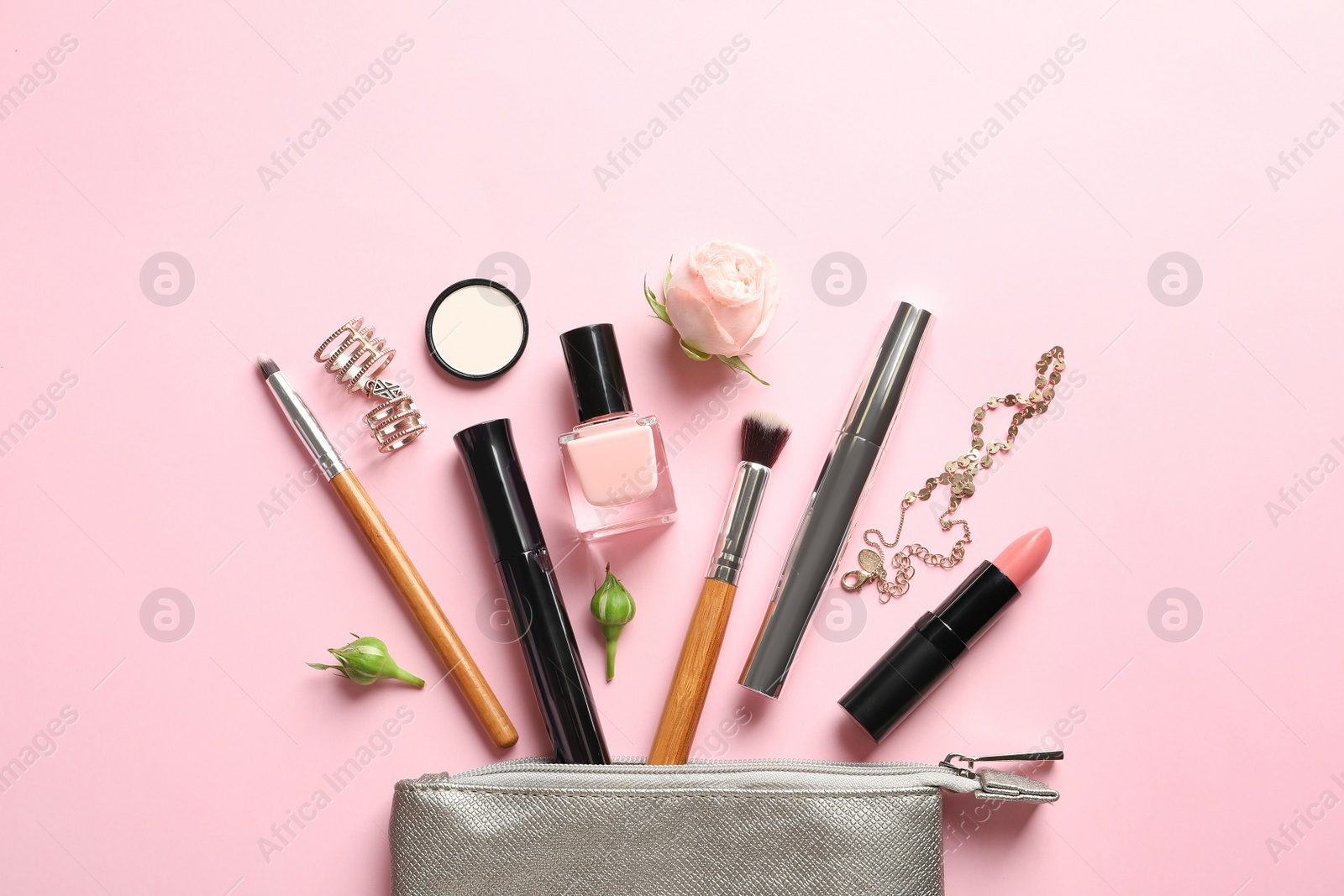 Photo of Flat lay composition with products for decorative makeup on pastel pink background