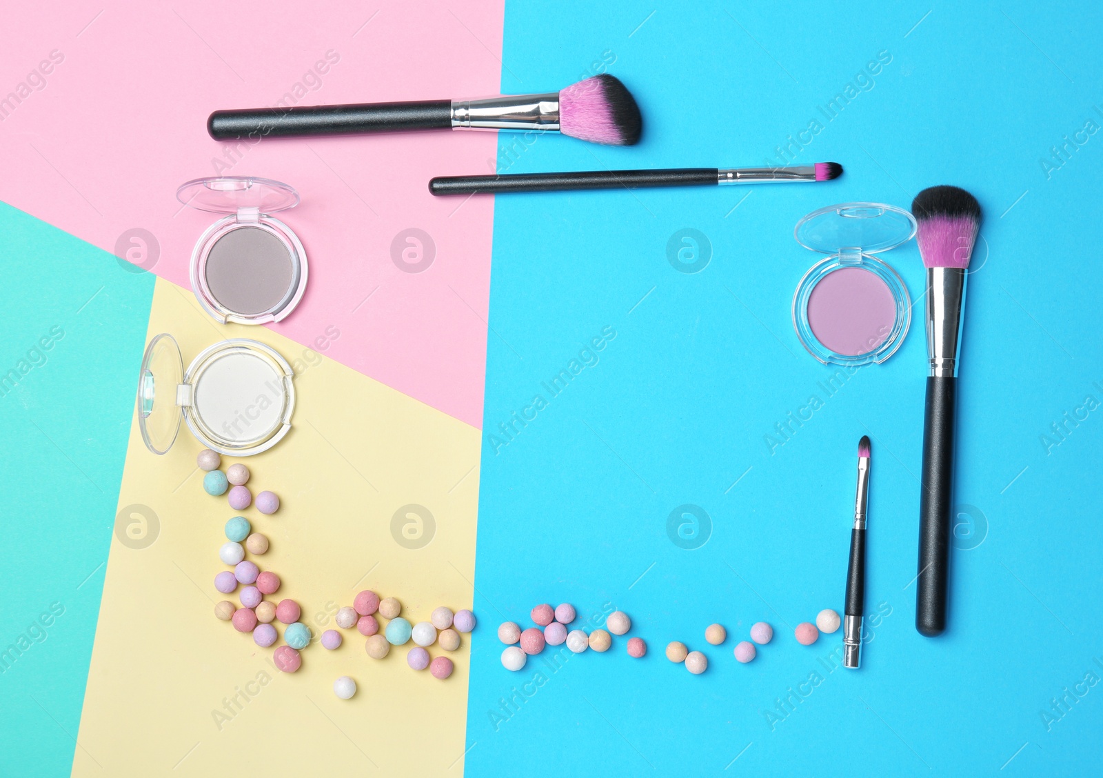 Photo of Decorative makeup products on color background