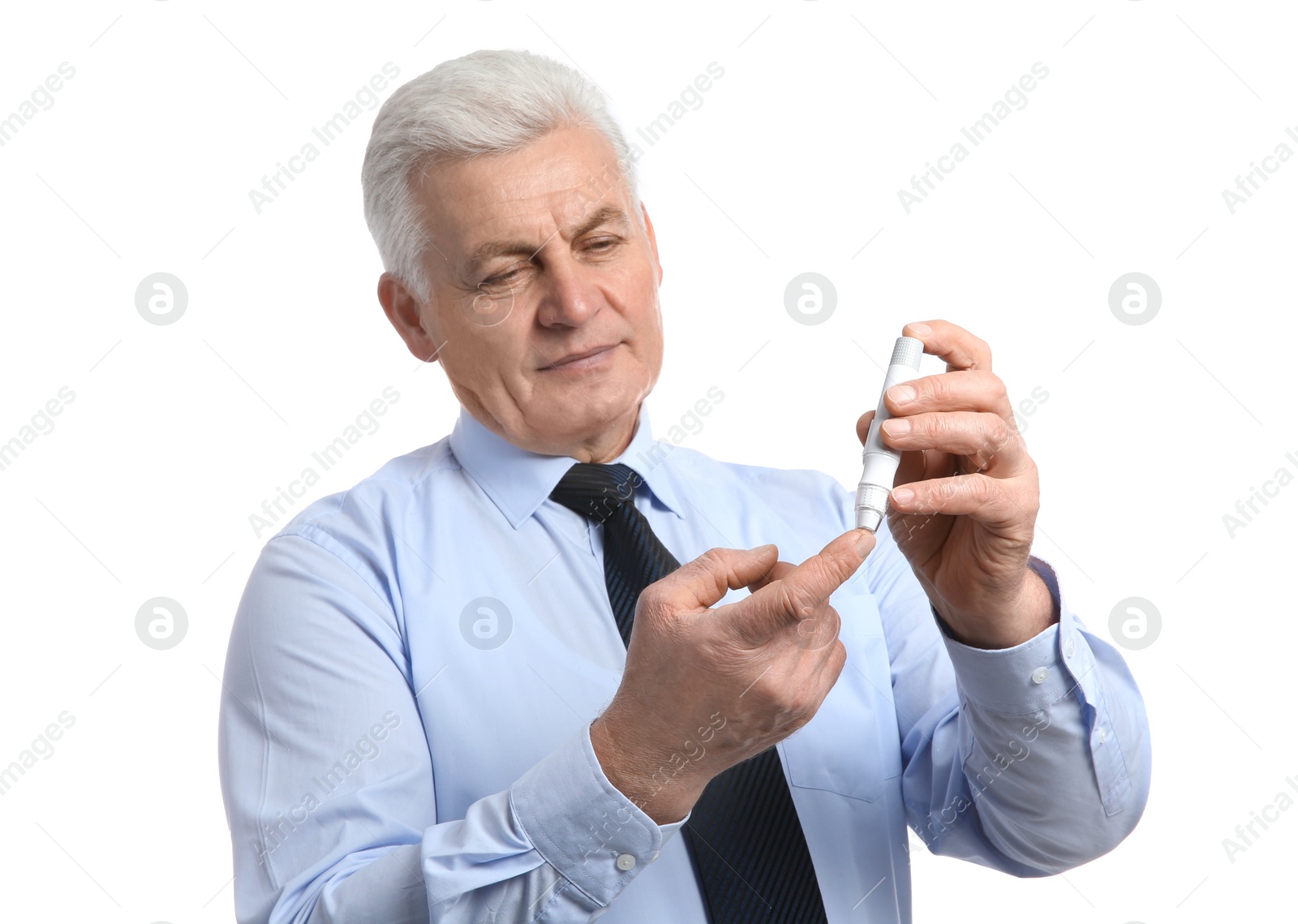 Photo of Senior man using lancet pen on white background. Diabetes control