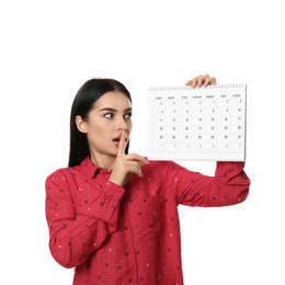 Photo of Young woman holding calendar with marked menstrual cycle days on white background